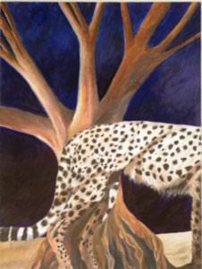cheetah body in front of a tree